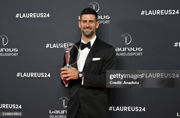 Novak Djokovic poses for a photo with the Laureus Sportsman of the Year Award during the 2024 Laureus World Sport Awards Madrid at Palacio De Cibeles...