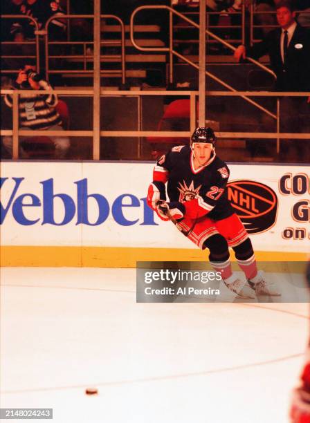 Left Wing Alexei Kovalev of the New York Rangers moves the puck in the game between the New York Islanders vs the New York Rangers on April 15, 1998...