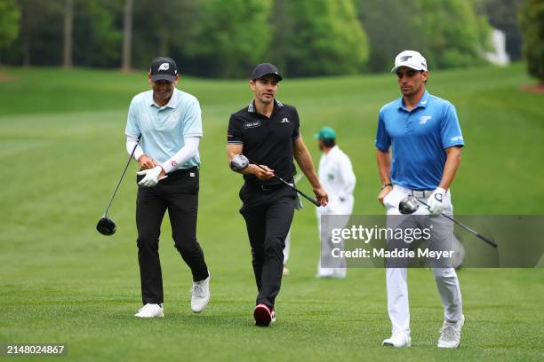 Sergio Garcia of Spain, Camilo Villegas of Colombia, and Joaquin Niemann of Chile walk to the 11th tee during a practice round prior to the 2024...