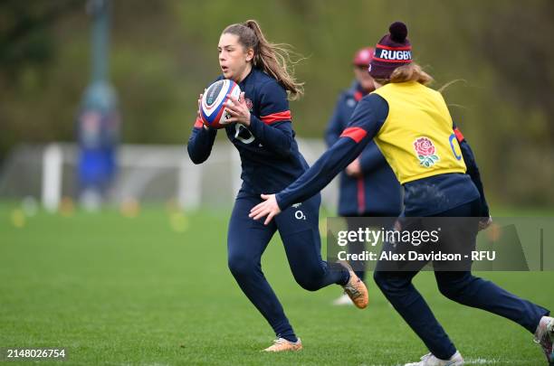 Holly Aitchison runs with the ball during a England Red Roses Training Session at Pennyhill Park on April 09, 2024 in Bagshot, England.