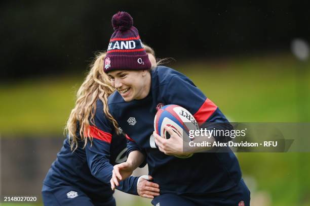 Emily Scarratt runs with the ball during a England Red Roses Training Session at Pennyhill Park on April 09, 2024 in Bagshot, England.