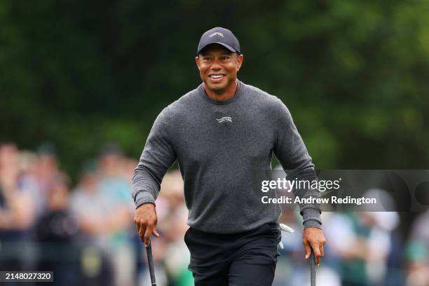 Tiger Woods of the United States reacts on the eighth hole during a practice round prior to the 2024 Masters Tournament at Augusta National Golf Club...