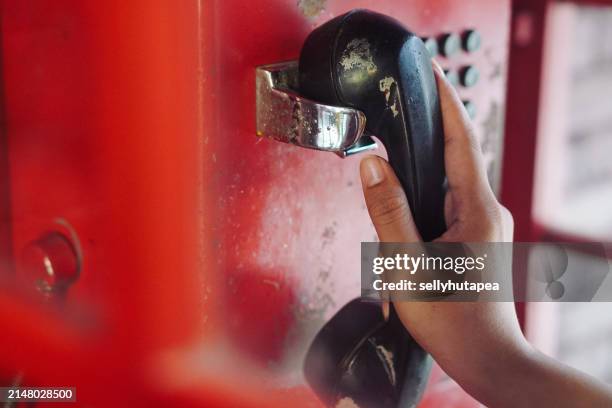 retro red telephone receiver-british red telephone box - indonesia street stock pictures, royalty-free photos & images