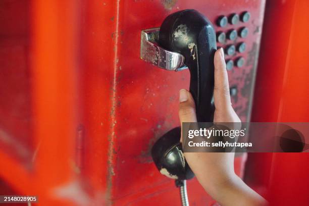 retro red telephone receiver-british red telephone box - indonesia street stock pictures, royalty-free photos & images