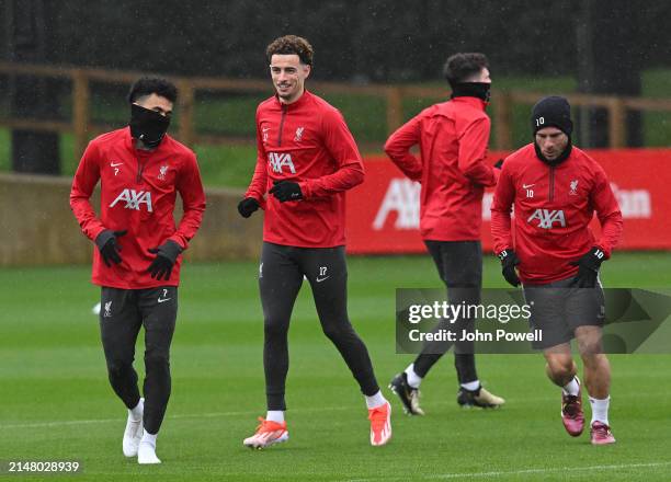 Luis Diaz, Curtis Jones and Alexis Mac Allister of Liverpool during a training session at AXA Training Centre on April 09, 2024 in Kirkby, England.