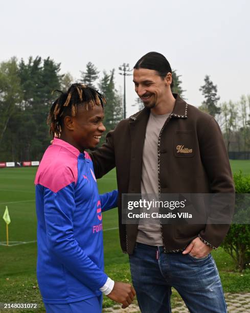 Milan Senior Advisor to Ownership Zlatan Ibrahimovic greets Samuel Chukwueze of AC Milan during a AC Milan training session at Milanello on April 09,...