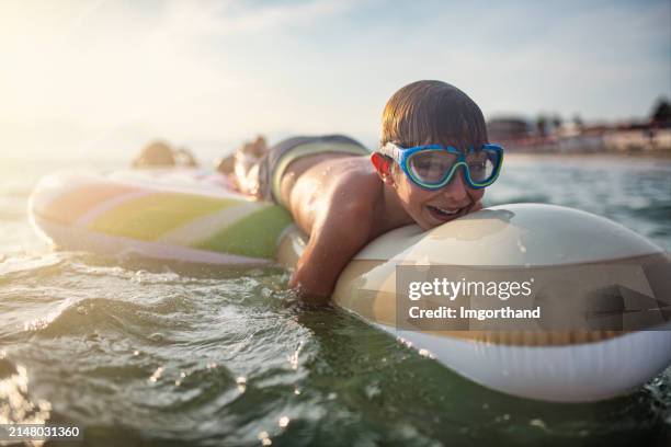 Boy Inflatable Raft 3,346 Inflatable Boats For Kids Stock Photos, High-Res Pictures, and ...