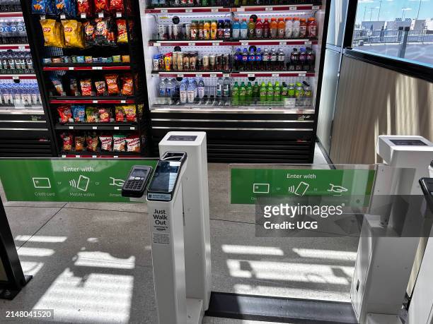 Goods Express, Amazon One kiosk, Pay enter identify with palm of hand, automated store in Charlotte International Airport with 3D interactive sign,...