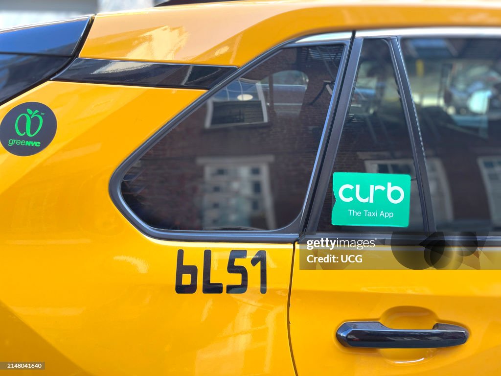 New York City Yellow Taxi Cab with Curb logo informs riders that for ...