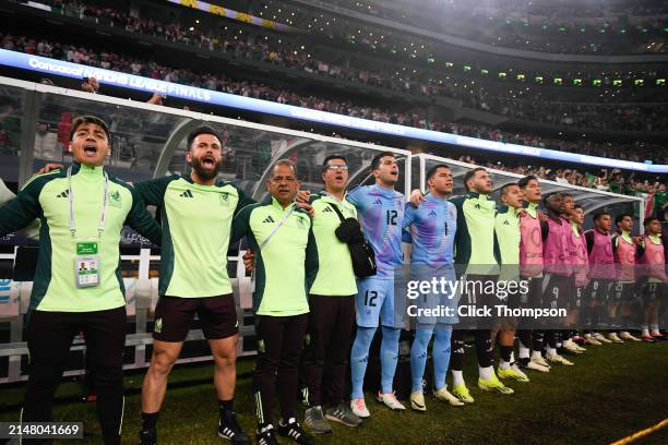 Players and coaching staff of Mexico sing their national anthem during the Concacaf Nations League final match between Mexico and USMNT at AT&T...