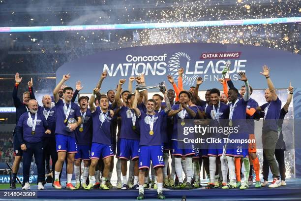 Team USA celebrates with the trophy after winning the Concacaf Nations League final match between Mexico and USMNT at AT&T Stadium on March 24, 2024...