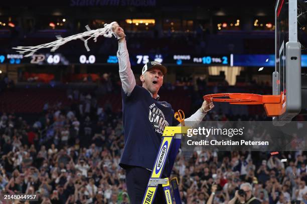 Head coach Dan Hurley of the Connecticut Huskies cuts down the net after beating the Purdue Boilermakers 75-60 to win the NCAA Men's Basketball...
