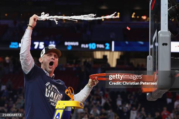 Head coach Dan Hurley of the Connecticut Huskies cuts down the net after beating the Purdue Boilermakers 75-60 to win the NCAA Men's Basketball...