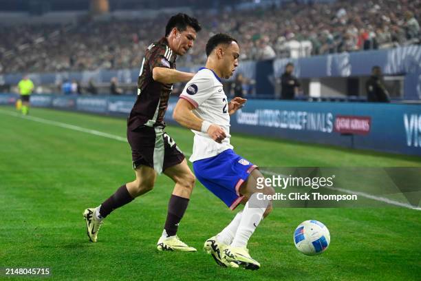 Sergino Dest of the United States blocks out Hirving Lozano of Mexico during the Concacaf Nations League final match between Mexico and USMNT at AT&T...
