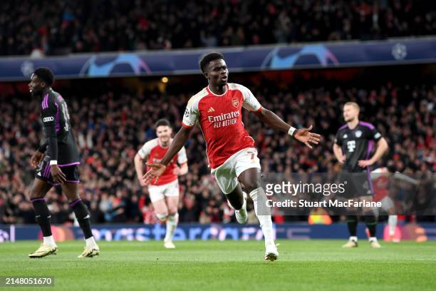 Bukayo Saka of Arsenal celebrates scoring his team's first goal during the UEFA Champions League quarter-final first leg match between Arsenal FC and...