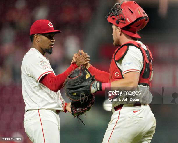 Alexis Díaz of the Cincinnati Reds celebrates with Tyler Stephenson following a baseball game against the Milwaukee Brewers at Great American Ball...