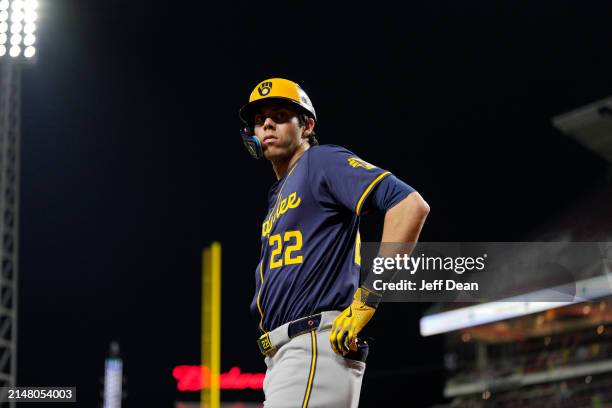 Christian Yelich of the Milwaukee Brewers warms up during a baseball game against the Cincinnati Reds at Great American Ball Park on April 08, 2024...