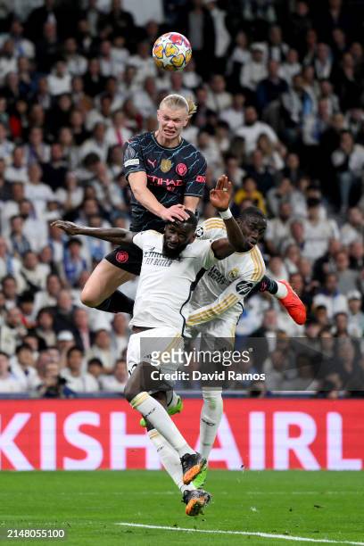 Erling Haaland of Manchester City battles for a header with Antonio Ruediger and Ferland Mendy of Real Madrid during the UEFA Champions League...