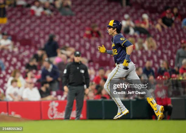 Christian Yelich of the Milwaukee Brewers rounds the bases after hitting a two-run home run against the Cincinnati Reds in the seventh inning of a...