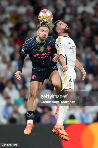 Jack Grealish of Manchester City battles for a header with Daniel Carvajal of Real Madrid during the UEFA Champions League quarter-final first leg...