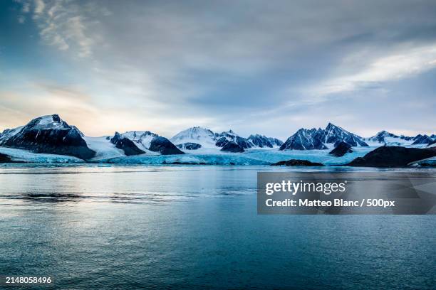 scenic view of lake by snowcapped mountains against sky - blanc stock pictures, royalty-free photos & images