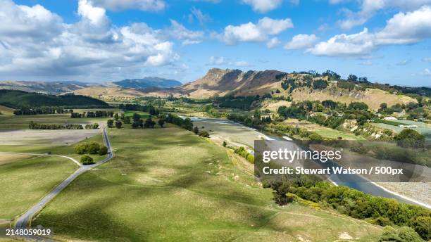 scenic view of landscape against sky - watson stock pictures, royalty-free photos & images