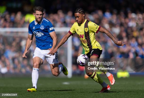 Wilson Odobert of Burnley and James Tarkowski of Everton in action during the Premier League match between Everton FC and Burnley FC at Goodison Park...