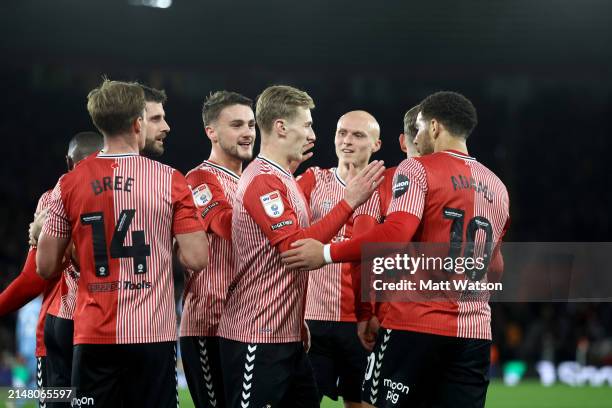 Che Adams of Southampton celebrates with team mates after scoring the second goal of the game during the Sky Bet Championship match between...