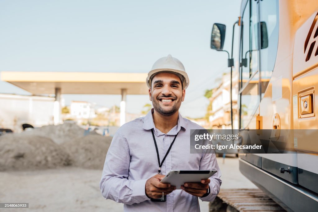 Young engineer at gas station construction site