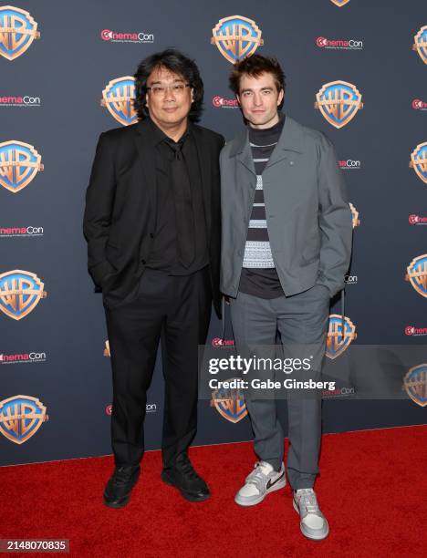 Bong Joon-ho and Robert Pattinson attend the Warner Bros. Pictures Presentation during CinemaCon 2024 at The Colosseum at Caesars Palace on April 09,...