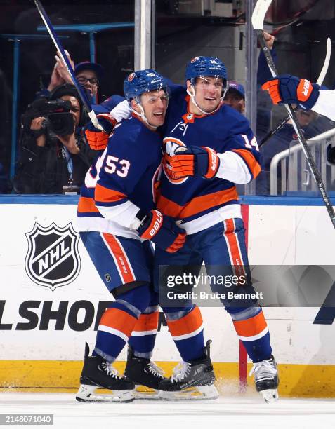 Bo Horvat of the New York Islanders celebrates his first period goal against the New York Rangers and is joined by Casey Cizikas at UBS Arena on...