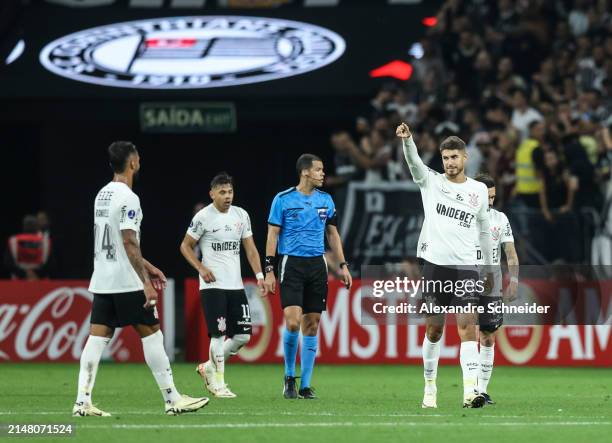 Pedro Raul of Corinthians celebrates with his teammates after scoring the forth goal of their team during a Group F match between Corinthians and...