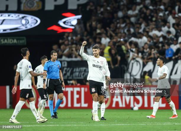 Pedro Raul of Corinthians celebrates with his teammates after scoring the forth goal of their team during a Group F match between Corinthians and...