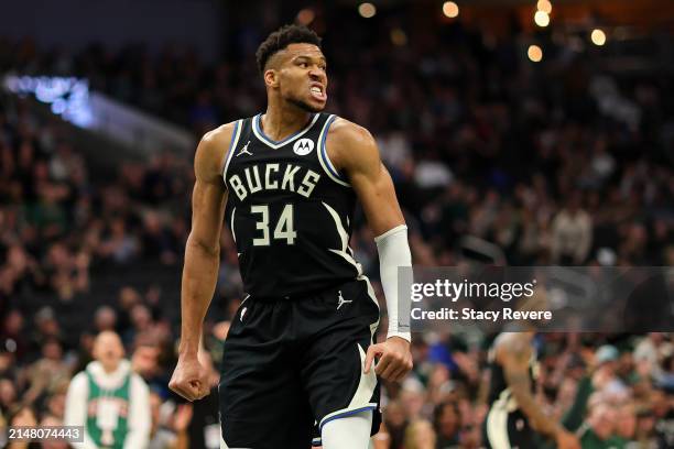 Giannis Antetokounmpo of the Milwaukee Bucks reacts to a score during the first half of a game against the Boston Celtics at Fiserv Forum on April...