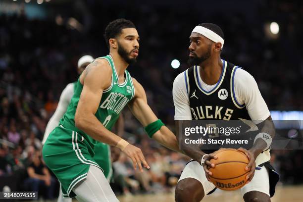 Bobby Portis of the Milwaukee Bucks is defended by Jayson Tatum of the Boston Celtics during the first half of a game at Fiserv Forum on April 09,...