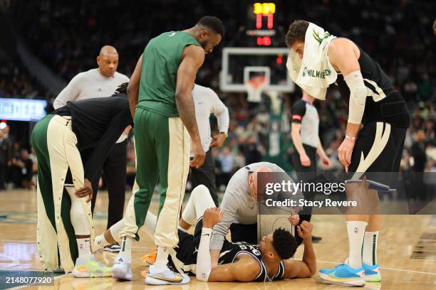 Giannis Antetokounmpo of the Milwaukee Bucks is injured during the second half of a game against the Boston Celtics at Fiserv Forum on April 09, 2024...