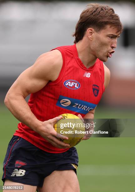 Jack Viney of the Demons controls the ball during a Melbourne Demons AFL training session at Gosch's Paddock on April 10, 2024 in Melbourne,...