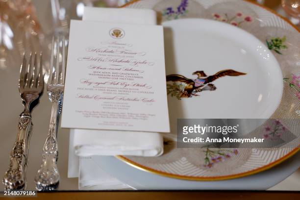 Place settings are displayed during a State Dinner media preview in the White House on April 09, 2024 in Washington, DC. First lady Jill Biden hosted...
