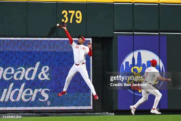 Will Benson of the Cincinnati Reds misses a catch against the wall in the seventh inning of a game against the Milwaukee Brewers at Great American...