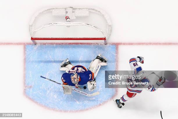 Chris Kreider of the New York Rangers celebrates his second period goal against Semyon Varlamov of the New York Islanders at UBS Arena on April 09,...