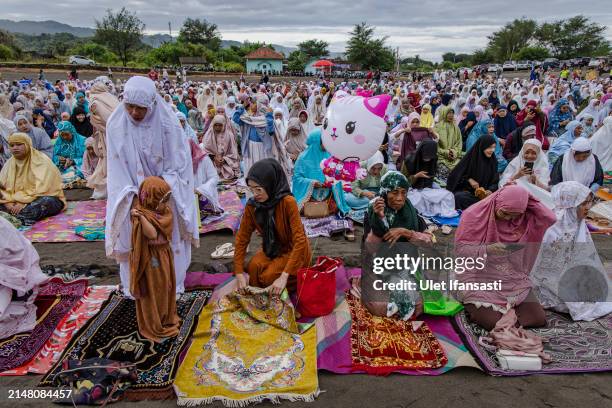 Indonesian Muslims attend the Eid Al-Fitr prayer on 'sea of sands' at Parangkusumo beach on April 10, 2024 in Yogyakarta, Indonesia. Muslims around...