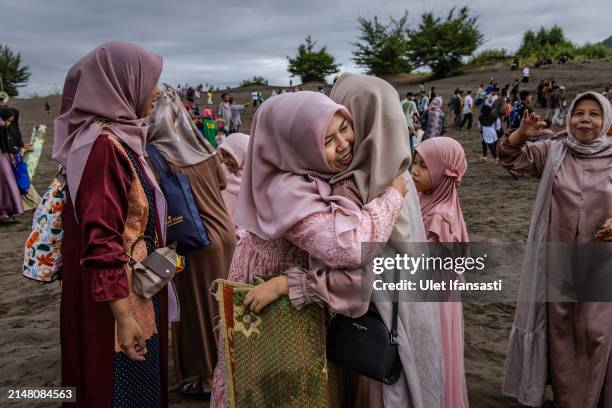 Indonesian Muslims celebrate after the Eid Al-Fitr prayer on 'sea of sands' at Parangkusumo beach on April 10, 2024 in Yogyakarta, Indonesia. Muslims...