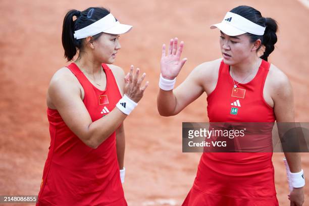 Zhu Lin and Guo Hanyu of China react in the Women's Doubles match against Liang En Shuo and Chan Hao-Ching of Chinese Taipei during the Billie Jean...