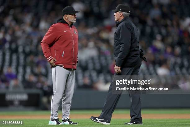Manager Torey Lovullo of the Arizona Diamondbacks questions a called balk with umpire Angel Hernandez of the Colorado Rockies in the sixth inning at...