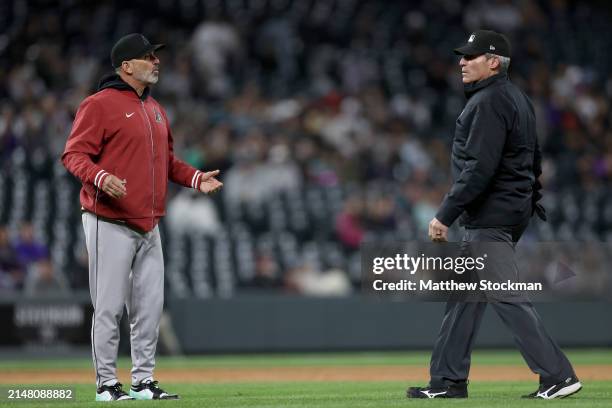 Manager Torey Lovullo of the Arizona Diamondbacks questions a called balk with umpire Angel Hernandez of the Colorado Rockies in the sixth inning at...