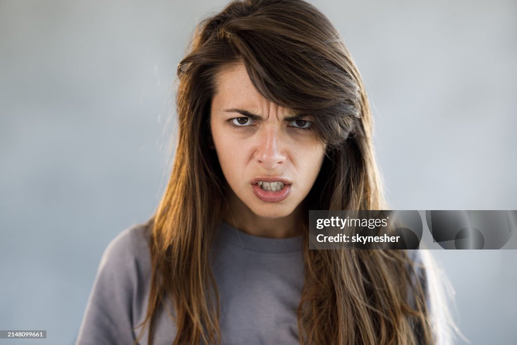 Portrait of young angry woman.
