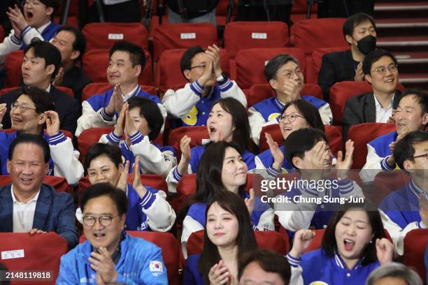 Candidates of Minjoo Union, affilated patry of South Korea's main opposition Democratic Party, watch TVs broadcasting the results of exit polls for...