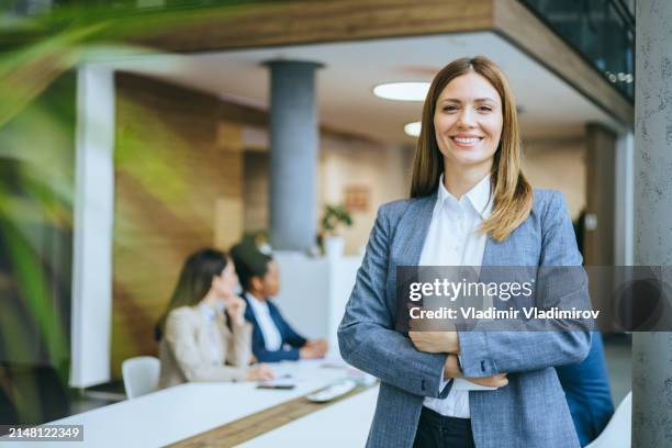 smiling professional with digital tablet - round table discussion women stock pictures, royalty-free photos & images
