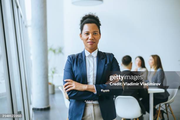 portrait of a confident business leader in office - round table discussion women stock pictures, royalty-free photos & images
