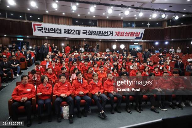 The South Korean ruling People Power Party’s leader Han Dong-hoon watches a news report on the results of exit polls for parliamentary election at...